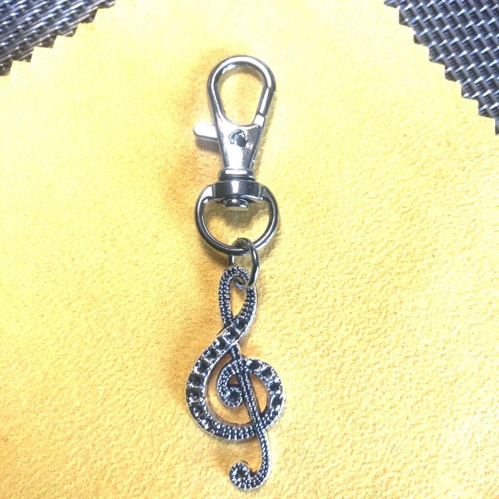 NWT, Handmade by A Charmed Life. Silver treble cleft.